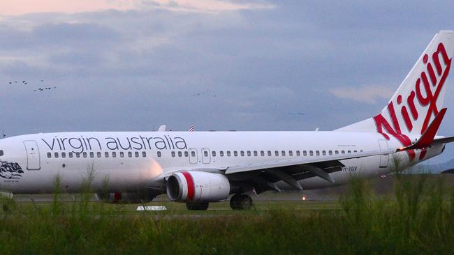 Virgin has threatened to withdraw from Queensland over Qantas monopoly.