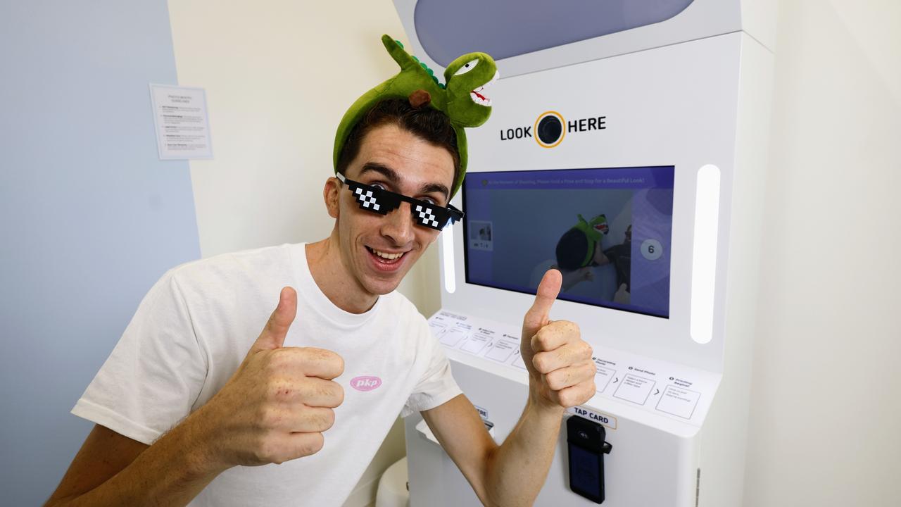 Pikapic Cairns co owner Thomas Breitenstein has some fun taking photos with the props and costume on offer, before receiving his selfie photos. Picture: Brendan Radke