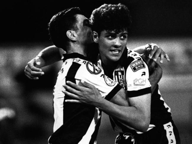 John Aloisi (right) celebrating with brother and Adelaide City teammate Ross Aloisi, having both broken into the first team as teenagers.