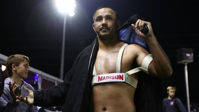 SYDNEY, AUSTRALIA - AUGUST 03: Braydon Trindall of the Sharks celebrates with fans after winning the round 22 NRL match between Cronulla Sharks and South Sydney Rabbitohs at PointsBet Stadium, on August 03, 2024, in Sydney, Australia. (Photo by Jeremy Ng/Getty Images)