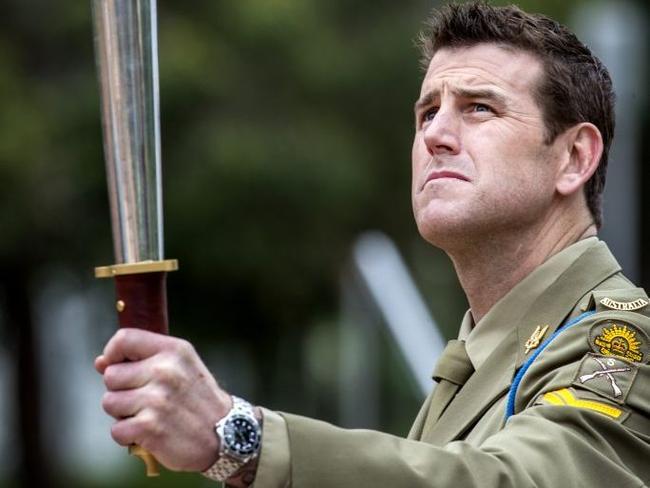 Victoria Cross recipient Corporal Benjamin Roberts-Smith with the Anzac torch. Picture: Contributed