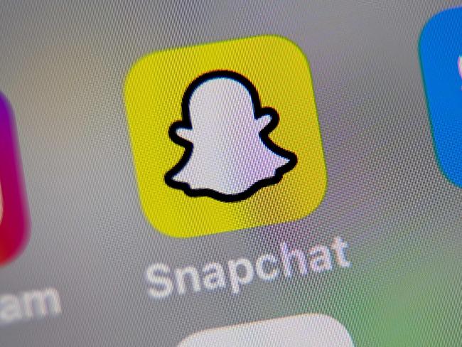 (FILES) In this file photo illustration taken on October 01, 2019, in Lille, France, shows the logo of mobile app Snapchat displayed on a tablet. - Snapchat announced on June 11, 2020, it would deliver breaking news as youth-focused social network unveiled a series of new features focused on information, entertainment and wellness. The California-based unit of parent Snap Inc. introduced a Happening Now service intended to quickly deliver news to its users. (Photo by DENIS CHARLET / AFP)
