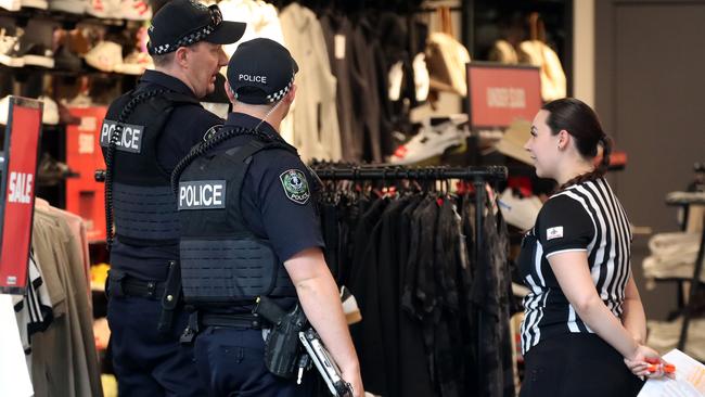 Police at the Rundle Mall Foot Locker store after the incident. Picture: Kelly Barnes