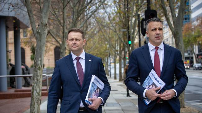 South Australian Premier Peter Malinauskas (right) and Treasurer Stephen Mullighan with the budget paper outside SA Parliment House and walking to the Convention Centre on North Terrace. Picture: NCA NewsWire / Emma Brasier.