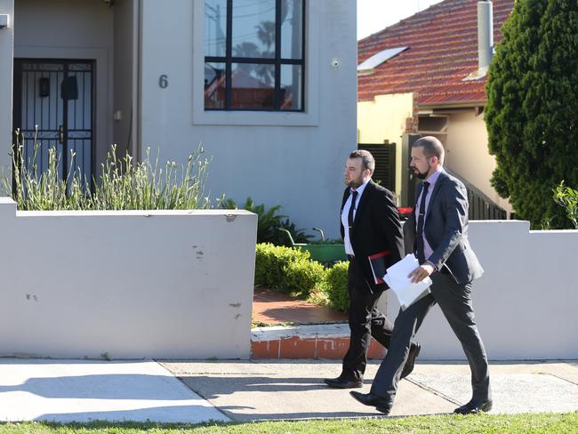 Detectives walk along the Earlwood street where Barbaro was shot. Picture: John Grainger.