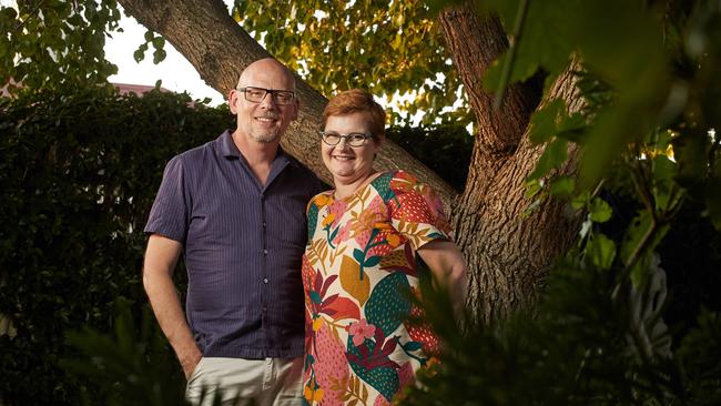 Daniel and Cheryl Cooper under the shade of a large tree at their West Croydon home, which they bought in 2002 and now is an oasis of waterwise Mediterranean plants after initially starting as an English garden. Picture: Matt Loxton