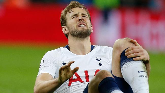 (FILES) In this file photo taken on January 13, 2019 Tottenham's English striker Harry Kane reacts after picking up an injury at the final whistle during the English Premier League football match between Tottenham Hotspur and Manchester United at Wembley Stadium in London. - Tottenham striker Harry Kane will be sidelined until March after suffering ankle ligament damage in Sunday's defeat against Manchester United. Kane sustained the injury to his left ankle in the closing moments of the 1-0 loss at Wembley and scans have now confirmed the extent of the problem. (Photo by Ian KINGTON / IKIMAGES / AFP) / RESTRICTED TO EDITORIAL USE. No use with unauthorized audio, video, data, fixture lists, club/league logos or 'live' services. Online in-match use limited to 45 images, no video emulation. No use in betting, games or single club/league/player publications.