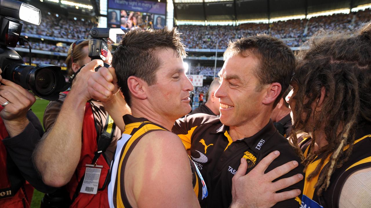 Shane Crawford and Alastair Clarkson after the 2008 grand final.