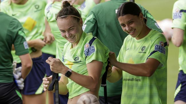 Caitlin Foord (left) and Sam Kerr prepare for a Matildas training session. Picture: Jenny Evans/Getty Images