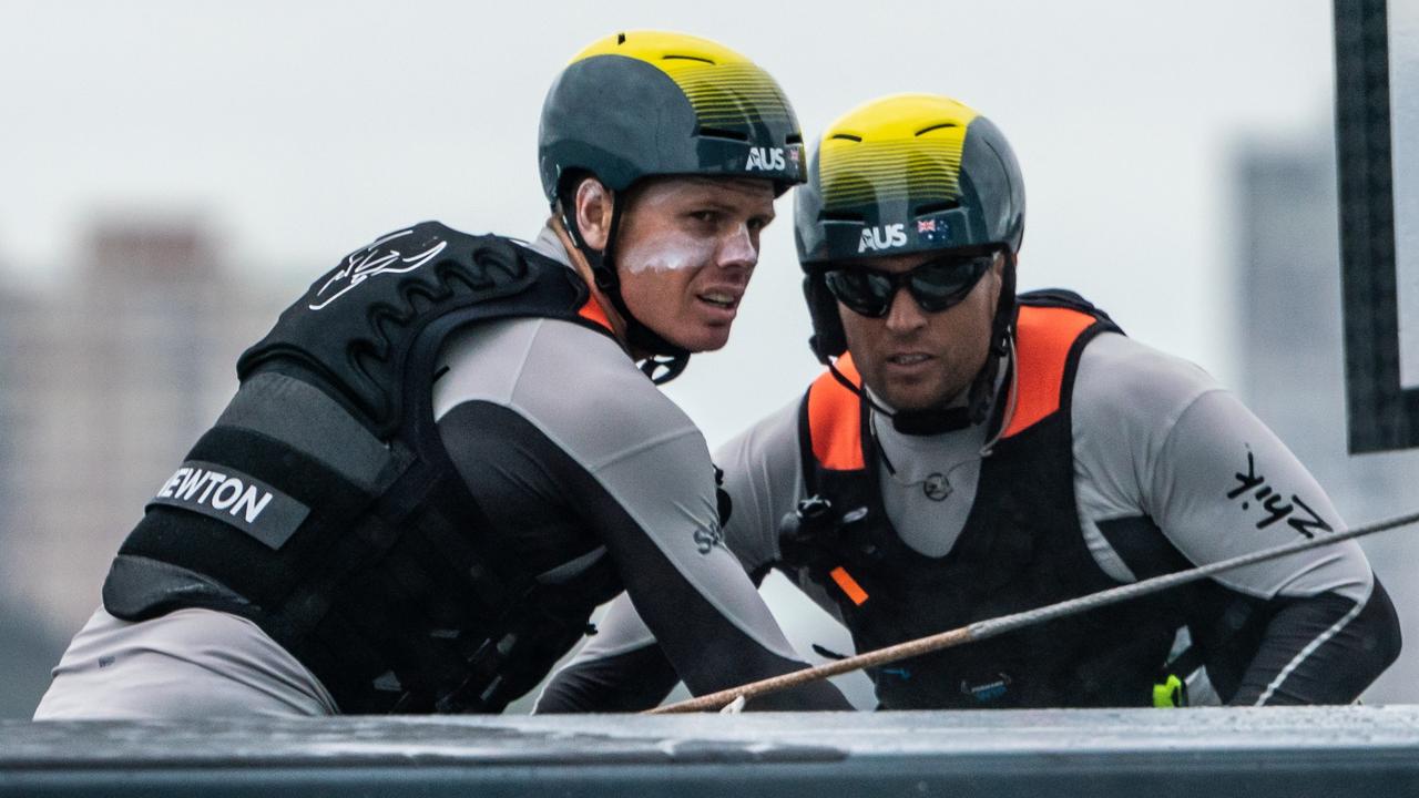 Sam Newton, left, and Ky Hurst, right, hard at work on the Australia’s foiling cat on Sydney Harbour. Pic: SailGP 