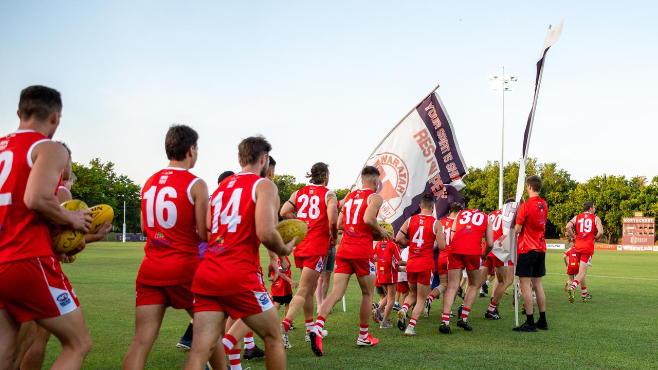 The Waratahs pay tribute to late, great ruckman Alexander ‘Rooch’ Aurrichio at the first game under lights at Gardens Oval. Picture: Aaron Black/AFLNT Media