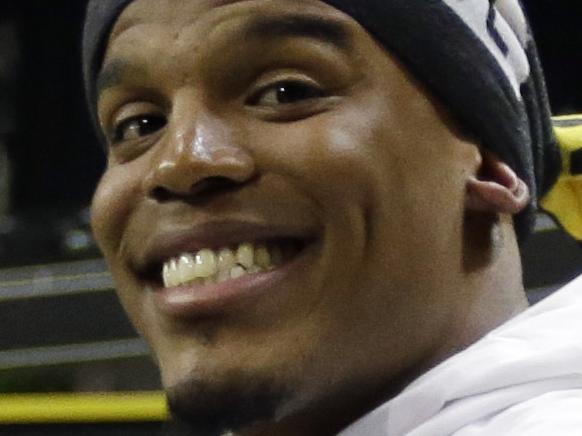 Carolina Panthers' Cam Newton smiles during Opening Night for the NFL Super Bowl 50 football game Monday, Feb. 1, 2016, in San Jose, Calif. (AP Photo/David J. Phillip)