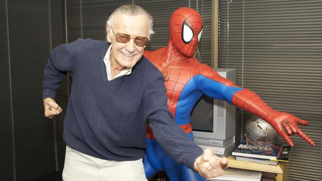 Lee poses with one of his most iconic characters - Spider-Man.