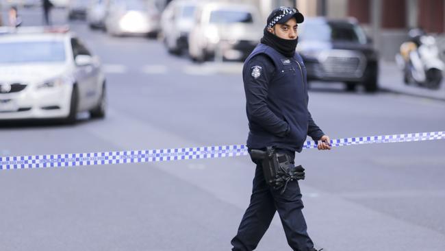 Police investigate a crime scene at the EQ Tower on A'Beckett Street in Melbourne, Saturday, July 21, 2018. Picture: AAP Image/Wayne Taylor.