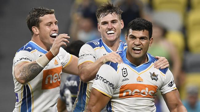 David Fifita celebrates with AJ Brimson and Jai Arrow after scoring a try. Picture: Ian Hitchcock/Getty Images