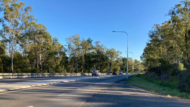 Two people were hospitalised after being trapped in a car for about an hour along the Bruce Highway near Bells Bridge early this morning. Picture: Scott Kovacevic