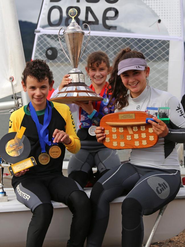 Travis, 13, Breanne, 11, and Kristen Wadley, 16, show off their trophy haul out at Lake Tinaroo, 2018. Picture: Natasha Emeck