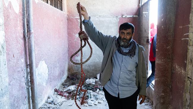 A man holds a rope at the Sednaya Military Prison as Syrians search for their relatives. Picture: Getty Images.