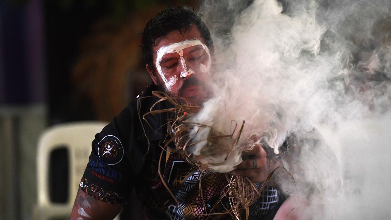 Trent Lee starts the fire for the smoking ceremony at Darwin Waterfront celebrations. Picture: (A)manda Parkinson