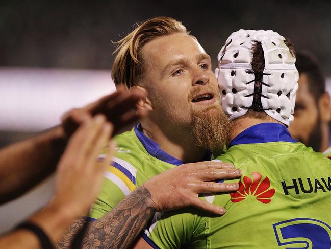 CANBERRA, AUSTRALIA - JULY 10: Blake Austin of the Raiders is congratulated by team mates after scoring a try during the round 18 NRL match between the Canberra Raiders and the Newcastle Knights at GIO Stadium on July 10, 2015 in Canberra, Australia. (Photo by Stefan Postles/Getty Images)