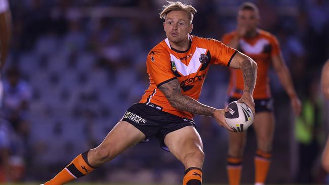 SYDNEY, AUSTRALIA - FEBRUARY 22: Blake Austin of the Tigers passes the ball during the NRL Trial match between the Wests Tigers and the Cronulla Sharks at Remondis Stadium on February 22, 2014 in Sydney, Australia. (Photo by Joosep Martinson/Getty Images)