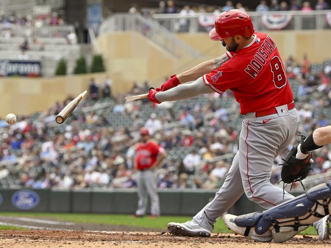 Mike Moustakas of the Los Angels Angels hits a broken-bat single against the Minnesota Twins in Minneapolis, Minnesota. Picture: Nick Wosika/Getty Images