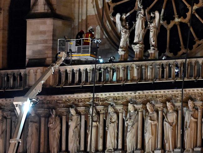 Firefighters continue to work at the site for inspection after the fire at the Notre Dame cathedral in Paris, France on April 15, 2019. (Photo by Mustafa Yalcin/Anadolu Agency/Getty Images)
