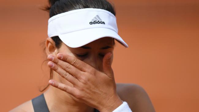 Garbine Muguruza fell to Kristina Mladenovic in three sets.