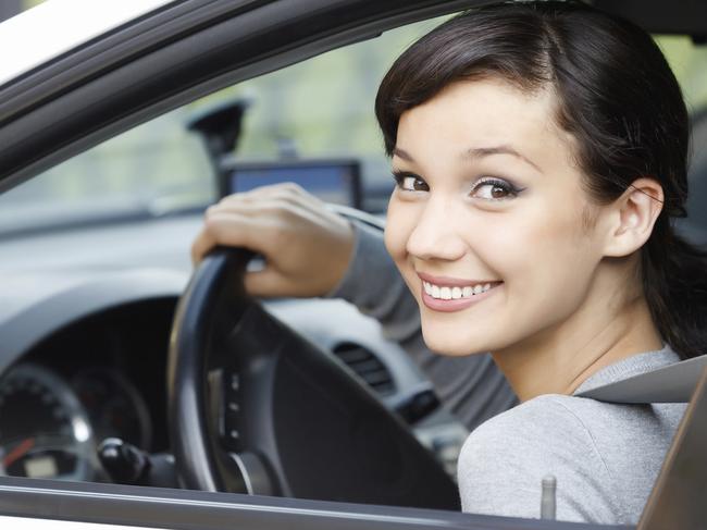 Pretty girl in a white car  istock image