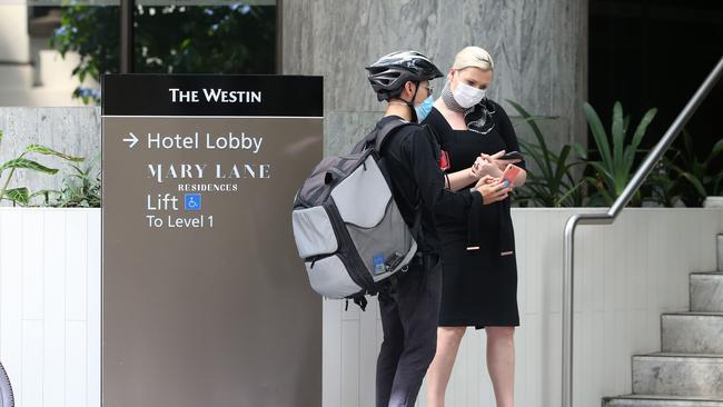 Guests in quarantine at Hotel Grand Chancellor getting transported in ambulances to The Westin in Brisbane City. Pics Tara Croser.