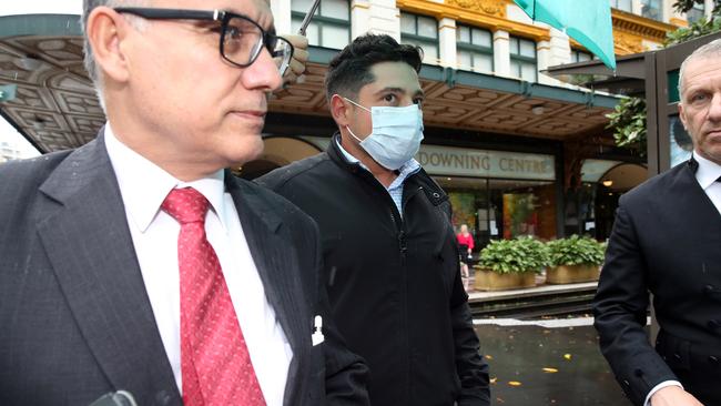 James Delinicolis (centre) outside the Downing Centre with his legal team. Picture: NCA NewsWire / David Swift