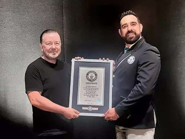Ricky Gervais receiving a Guinness World Record for his special, <i>Armageddon</i>, receiving the highest gross for a single stand-up performance ever. Picture: Guinness World Records