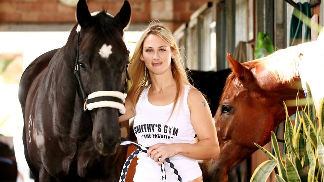 Gold Coast jockey Laura Cheshire will race for the first time on Friday at the Sunshine Coast and Saturday at the Gold Coast after breaking her neck in a fall 6 months ago. Pictured with Emition, her horse which she will race.