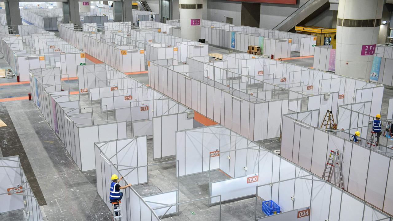 An employee works at a makeshift hospital that will be used for Covid-19 coronavirus patients in Guangzhou. Picture: AFP.