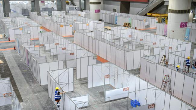 An employee works at a makeshift hospital that will be used for Covid-19 coronavirus patients in Guangzhou. Picture: AFP.