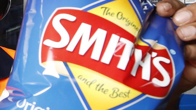 Machine operator Faraaz Abdullah posing at the Smith Chip Snack Foods, Brisbane 18th of November 2019.   (AAP Image/Josh Woning)