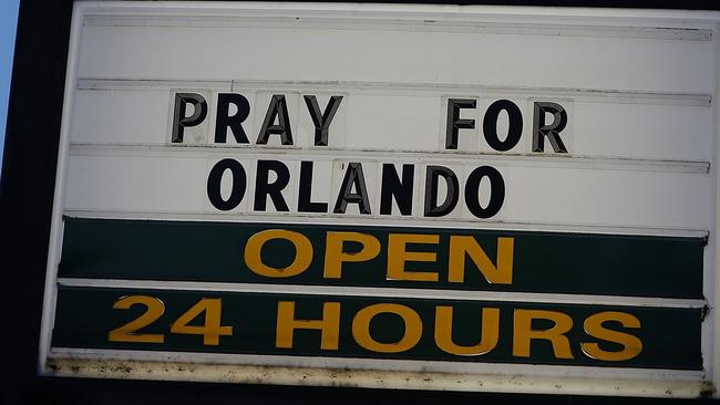 A sign reading " Pray for Orlando" is seen near the Pulse gay nightclub. Picture: AFP