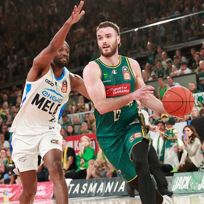 HOBART, AUSTRALIA - MARCH 28: Sean Macdonald of the JackJumpers handles the ball against Ian Clark of United during game four of the NBL Championship Grand Final Series between Tasmania JackJumpers and Melbourne United at MyState Bank Arena, on March 28, 2024, in Hobart, Australia. (Photo by Kelly Defina/Getty Images)