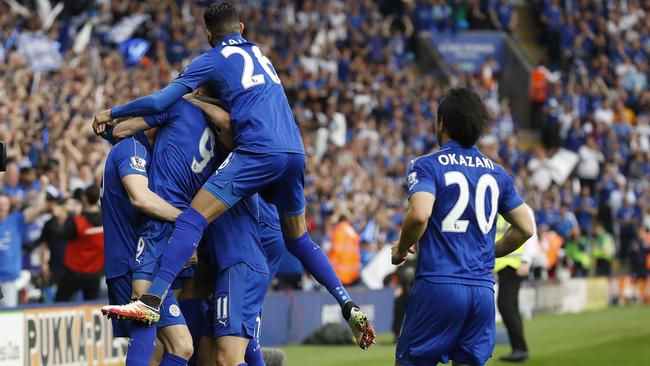 Leicester players celebrate after scoring the opening goal.