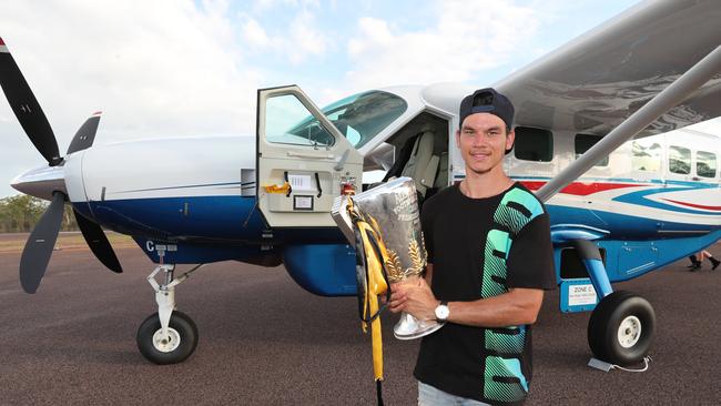 Richmonds Daniel Rioli brings the 2019 Premiership Cup home to Pirlangimpi, his home community on Melville Island, which is a part of the Tiwi Islands. 05/11/2019. Daniel Rioli with the cup after it was flown to the Tiwi Islands . Pic: Michael Klein