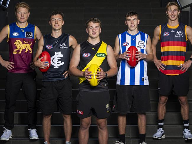 MELBOURNE, AUSTRALIA - NOVEMBER 21: (L-R) Levi Ashcroft of the Lions, Jagga Smith of the Blues, Samuel Lalor of the Tigers, Finn O'Sullivan of the Kangaroos and Sid Draper of the Crows pose for a photograph during the 2024 AFL Draft at Marvel Stadium on November 21, 2024 in Melbourne, Australia. (Photo by Daniel Pockett/AFL Photos via Getty Images)