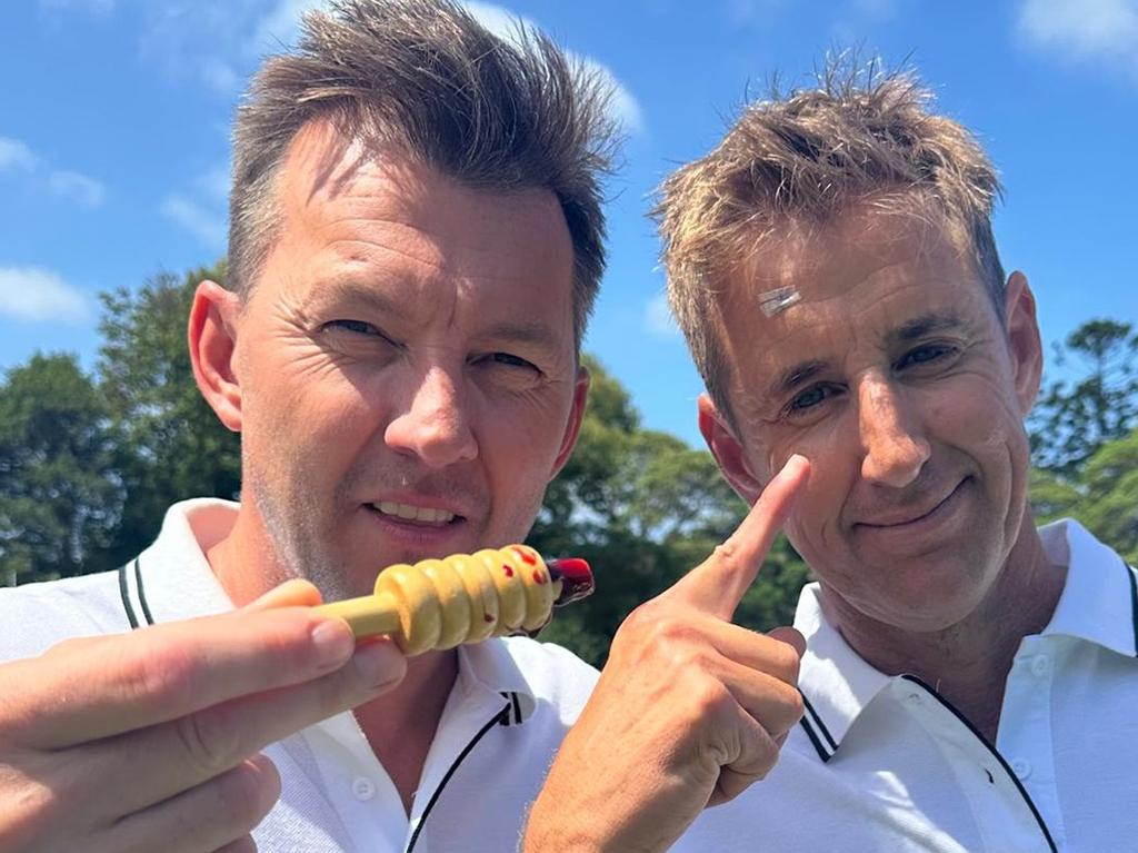 Brett Lee holds the bail which collected Mark Howard, and left the presenter needing stitches. Pls credit: Kayo Sports