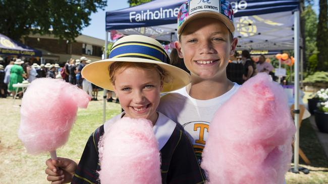 Jemima and Fred Hudson enjoy fairy floss at the Fairholme College Spring Fair, Saturday, October 21, 2023. Picture: Kevin Farmer