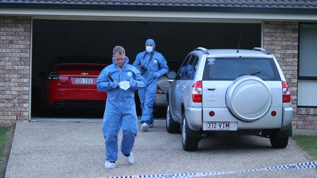 Police in front of an Upper Coomera house where the pair were killed. Picture Glenn Hampson