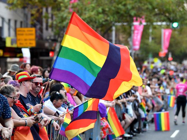 Crowds line Oxford St to watch the Mardi Gras parade. Picture: AAP Image/Joel Carrett