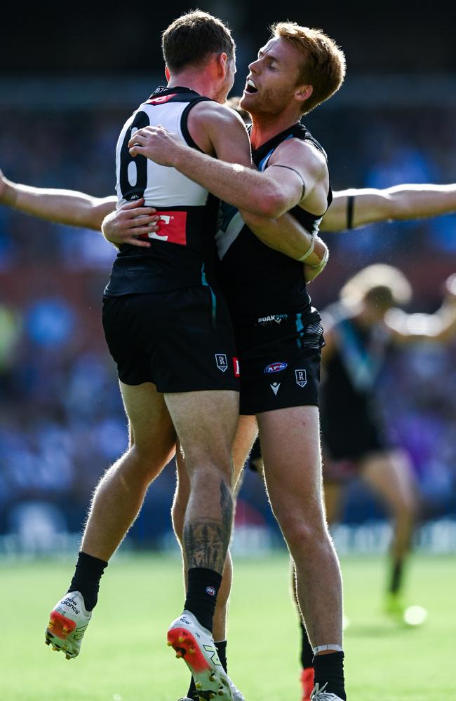 Kane Farrell and Willem Drew enjoy a goal in Port Adelaide’s romp.