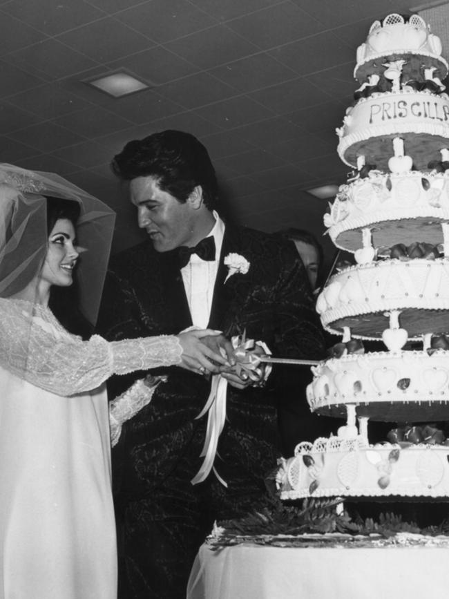 Elvis and Priscilla Presley cutting their wedding cake at the Aladdin Hotel in Las Vegas, 1 May 1967. Picture: EPE.