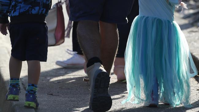 Parents pick children up from Labrador State School after Imperial Parade was opened. Photo: Regi Varghese