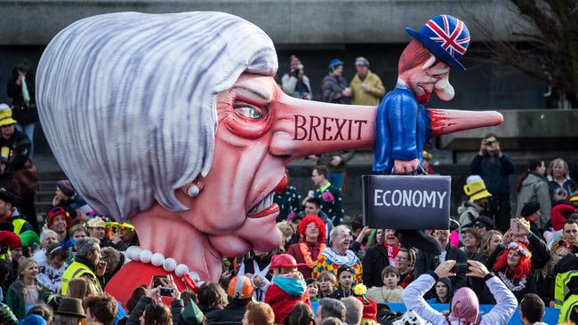 British PM Theresa May and Brexit are lampooned on a float at a carnival in Dusseldorf, Germany, below. Picture: Getty Images 