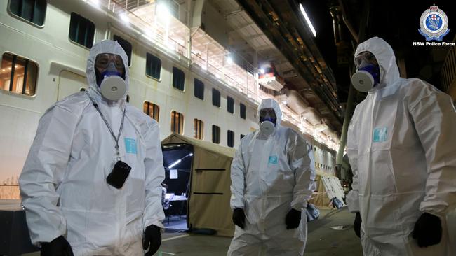 NSW Police officers prepare to raid the coronavirus-stricken Ruby Princess cruise ship and seize its black box at Port Kembla on Wednesday. Picture: NSW Police via AFP